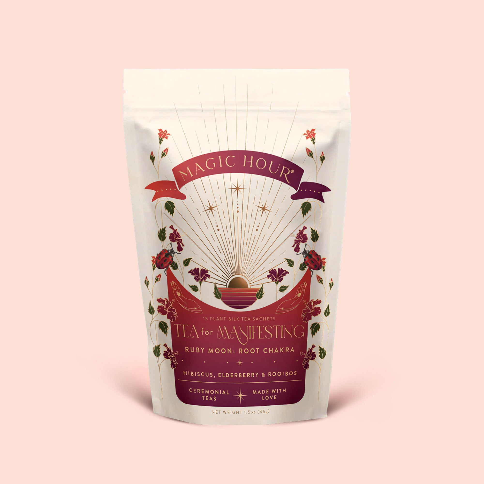 A beautifully floral pouch of Tea for Manifesting: Ruby Moon—an herbal blend of hibiscus, elderberry, and passionfruit—designed to balance your energy from root to crown chakra.