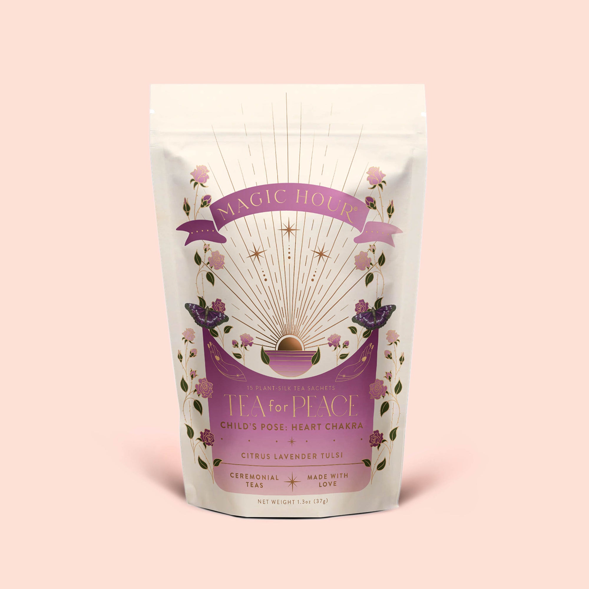 A pastel pink tea package labeled "Tea for Peace: Child's Pose" features floral illustrations, gold rays, and decorative text that highlights its citrus, lavender, and tulsi herbal tea blend. The packaging’s gentle, soothing design invites you to relax your nervous system with each sip.