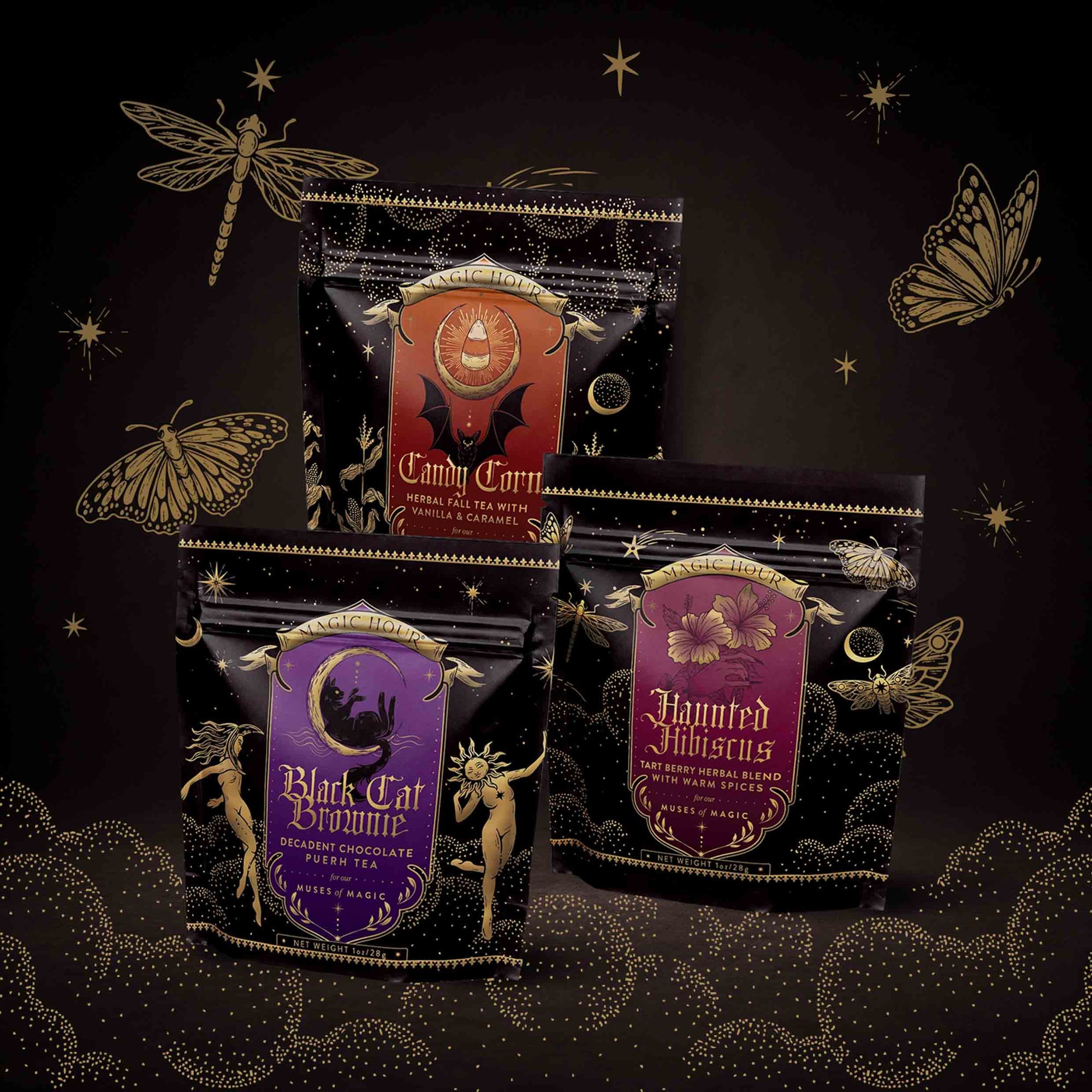 Three decorative tea packages from the Halloween Bundle—“Candy Corn,” “Black Cat Bonfire,” and “Haunted Hibiscus”—are displayed amid gold illustrations of stars, a dragonfly, and a butterfly on a dark, magical-themed background. This Small Batch Magic Halloween Bundle features limited edition selections crafted with hand-blended teas for an enchantingly unique experience.