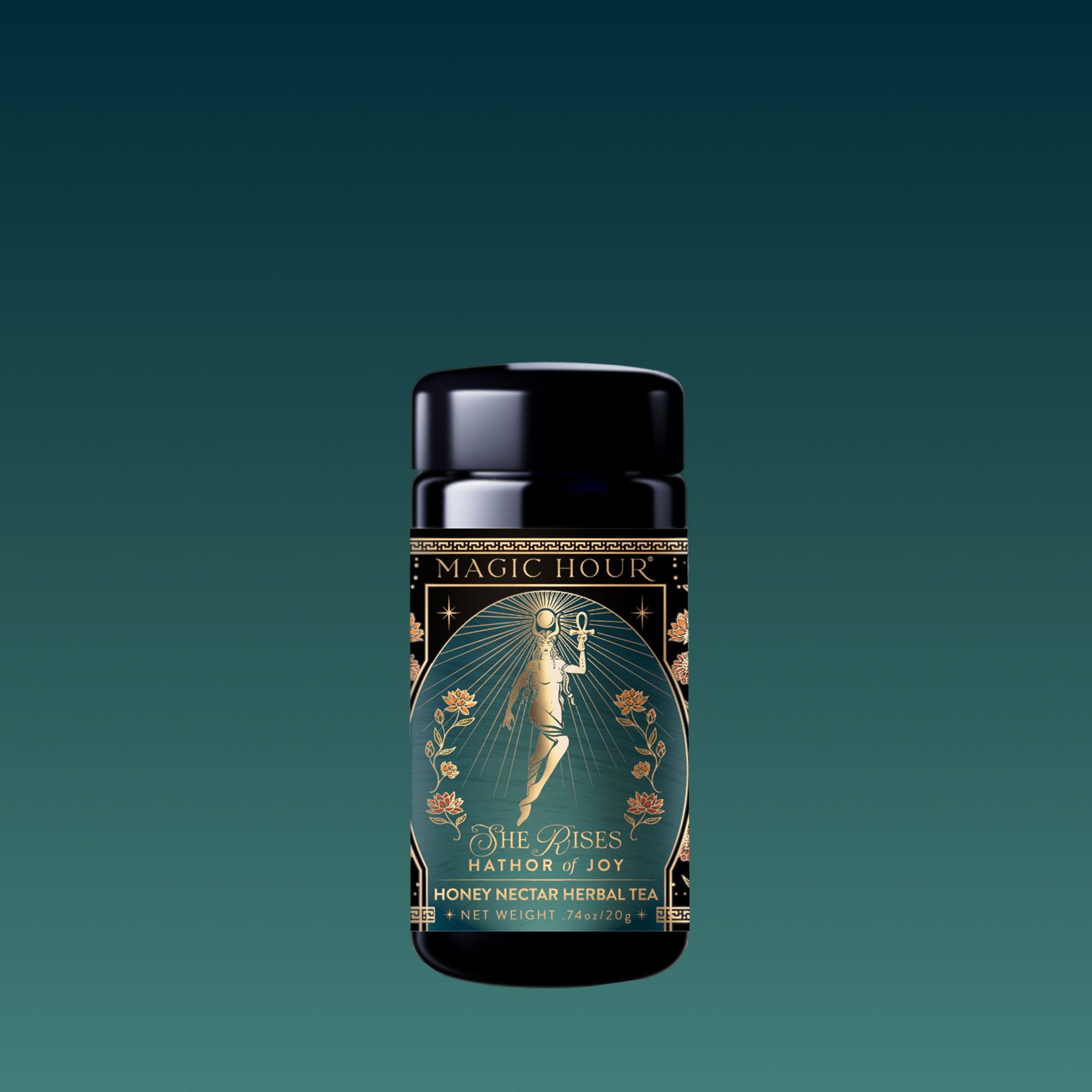 A black canister of Monthly Magic Tea Journey Subscription features an art deco label with a woman holding a staff amid flowers and gold accents, evoking a goddess ritual vibe against a teal gradient background.