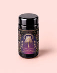 A black tea canister labeled “Monthly Magic Tea Journey Subscription” with an ornate design featuring a woman and two cats—perfect for goddess ritual tea and Divine Feminine exploration.