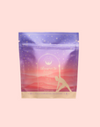 Tea package with a gradient design on a pink background