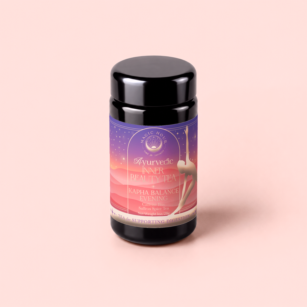 A black jar labeled “Kapha: Caffeine-Free Saffron Spice Tea” stands on a pale pink background. The purple and pink label features a silhouette of a stretching woman and emphasizes that this tea is designed for Ayurvedic digestion support and is caffeine-free.