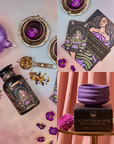 A collection of enchanting items: a purple teapot with matching cup, dried flowers, an intricately designed tea infuser, two tarot cards showcasing a moon motif, a black celestial-themed tea canister, and a purple star-patterned cup presented on the "Exquisite Star Sips" box from the La Luna Tea & Accessory Gift Set.