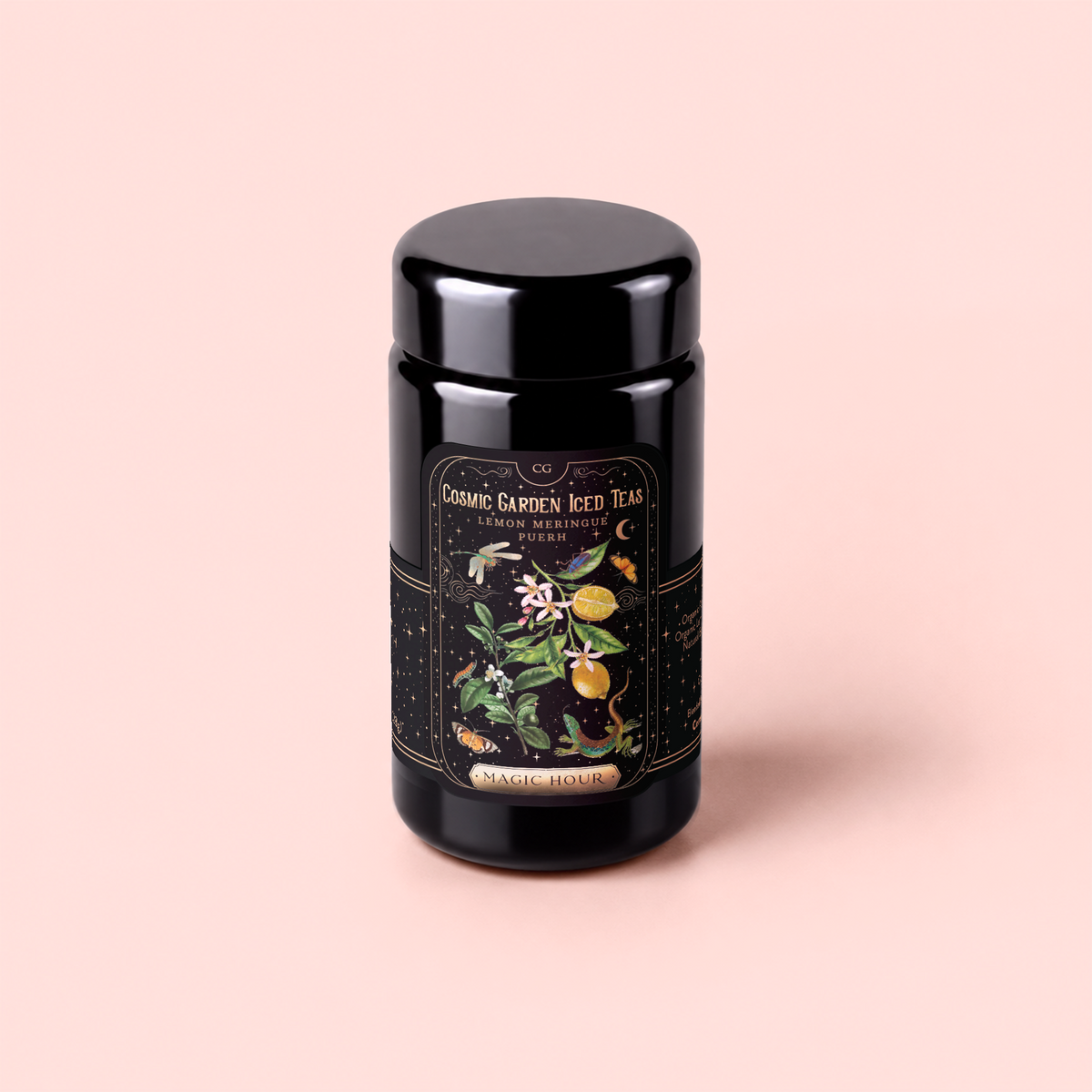 A sleek black tea canister adorned with a vibrant, botanical label that reads “Cosmic Garden Iced Teas” and “Magic Hour,” showcases playful illustrations of fruits and flowers on a soft pink background. This elegant packaging highlights the Lemon Meringue Puerh Black Iced Tea, an invigorating blend crafted for those seeking a refreshing and revitalizing weight loss tea experience.