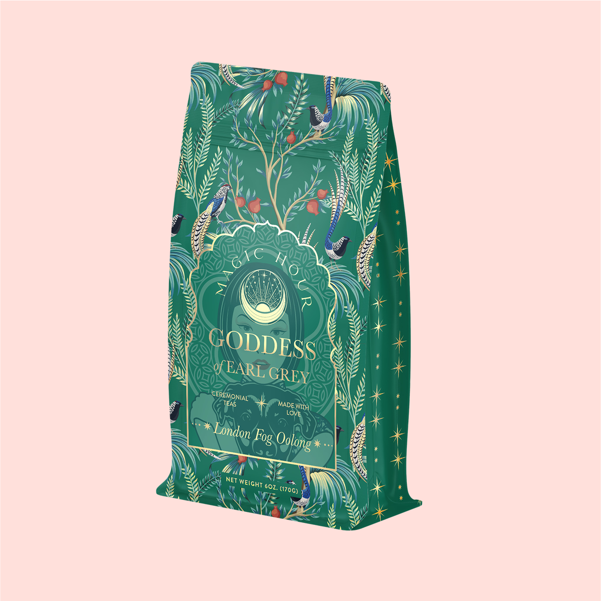 The packaging, featuring colorful birds and botanical illustrations, is for &quot;London Fog Oolong&quot; with a label highlighting hints of bergamot, vanilla, and notes like &quot;Magic Hour Goddess Earl Grey&quot; and &quot;Personal Alchemy.&quot; The net weight is 3 oz (100 g).