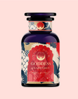 The "London Fog Rooibos" dark bottle, adorned with floral and celestial patterns in blue, red, and cream, features a sun emblem against a pink background. This caffeine-free blend is infused with bergamot for a citrusy twist and crafted with love for an enchanting allure.