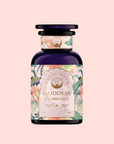 A dark blue bottle labeled "London Fog White" with a floral and botanical design, featuring bergamot hints, set against a soft pink background.