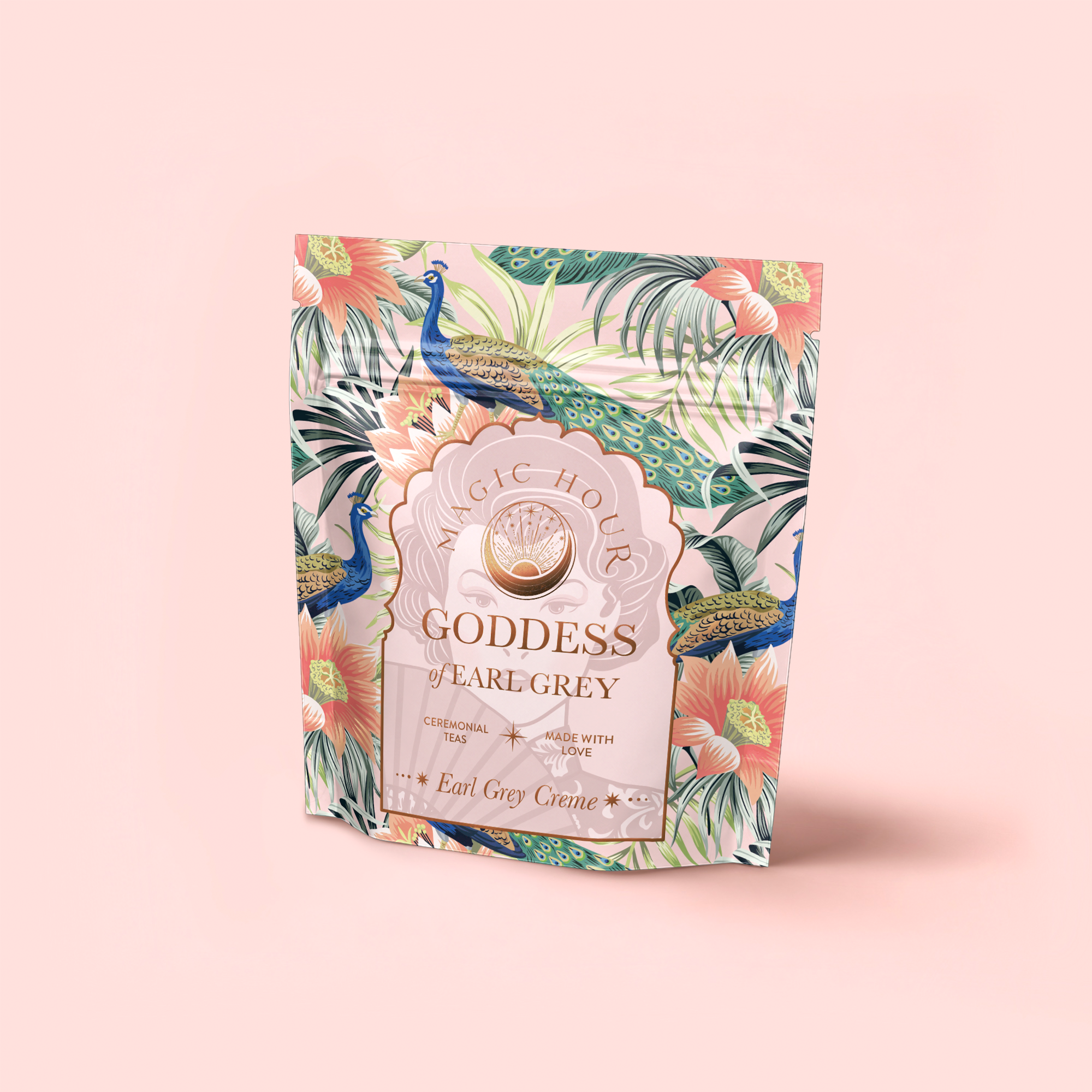 A standing pouch of "London Fog White" tea features a colorful peacock, tropical leaves, and flowers on pale pink. The label highlights "Ceremonial Tea," "Made With Love," and fragrant bergamot with Bai Mudan white tea.