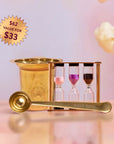The Loose Leaf Tea Starter Set includes a gold strainer, "Magic Hour" gold tea scoop, and a three-chamber tea timer with pink, purple, and black sand. A label shows "$62 value for $33." Cream flowers decorate the background.