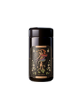 A black cylindrical container with a glossy finish showcases an ornate label adorned with a colorful swirling design of a snake and flowers, featuring the text "Magic Hour" and "The World.