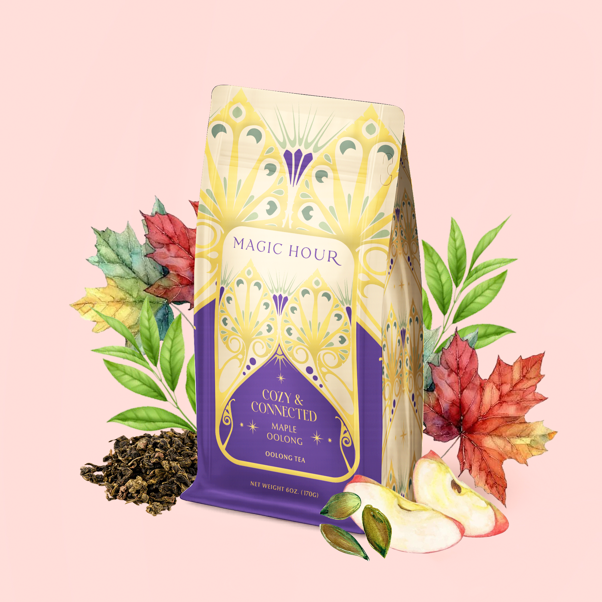 A decorative package of Maple Oolong: Cozy & Connected tea—a metabolism-boosting blend—is surrounded by loose tea leaves, red and green leaves, and apple slices on a light pink background, evoking the cozy charm of an autumn tea blend.