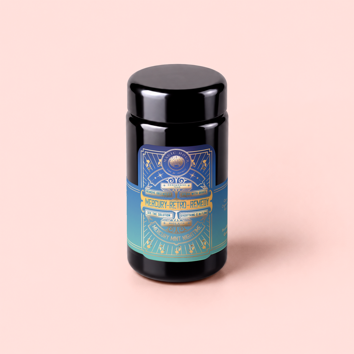 A dark jar with a colorful label reading “Mercury Mint Nighttime: Vanilla Mint Lavender Jasmine Tea – Caffeine Free!” sits on a light pink background. The label, adorned with celestial designs and text in gold, blue, and teal hues, hints at this herbal tea’s calming blend of vanilla, mint, lavender, and jasmine—specially crafted for gentle digestion support without caffeine.