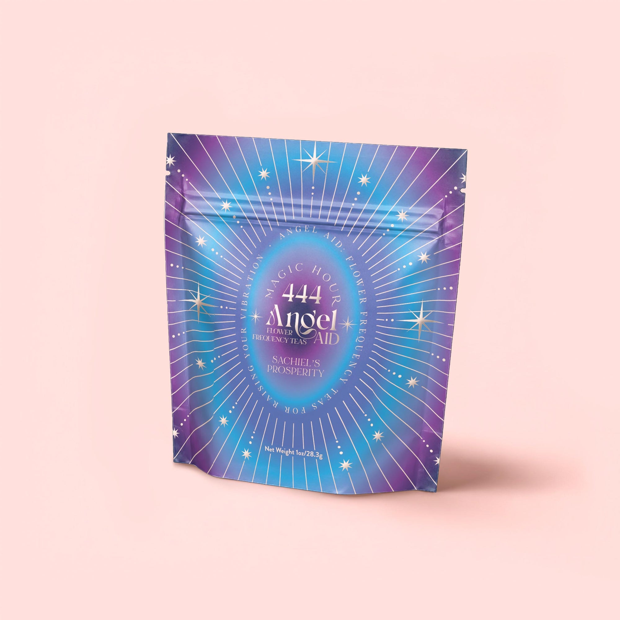 A purple-blue gradient pouch with starbursts and "444 Angel Frequency Aid Sachets Prosperity" in white text showcases 444: Sachiel's Prosperity—an apple-berry herbal tea with butterfly pea flower and blue spirulina—on a light pink background.