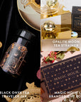 A promotional image highlighting the Black Onyx December Birthstone Mini Gift Set, featuring three tea-related treasures: a Black Onyx Tea Traveler Jar, an Opalite Moon Tea Strainer, and a Magic Hour Branded Gift Box. These items exude grounding energy against a luxurious gold and black backdrop with decorative elements.