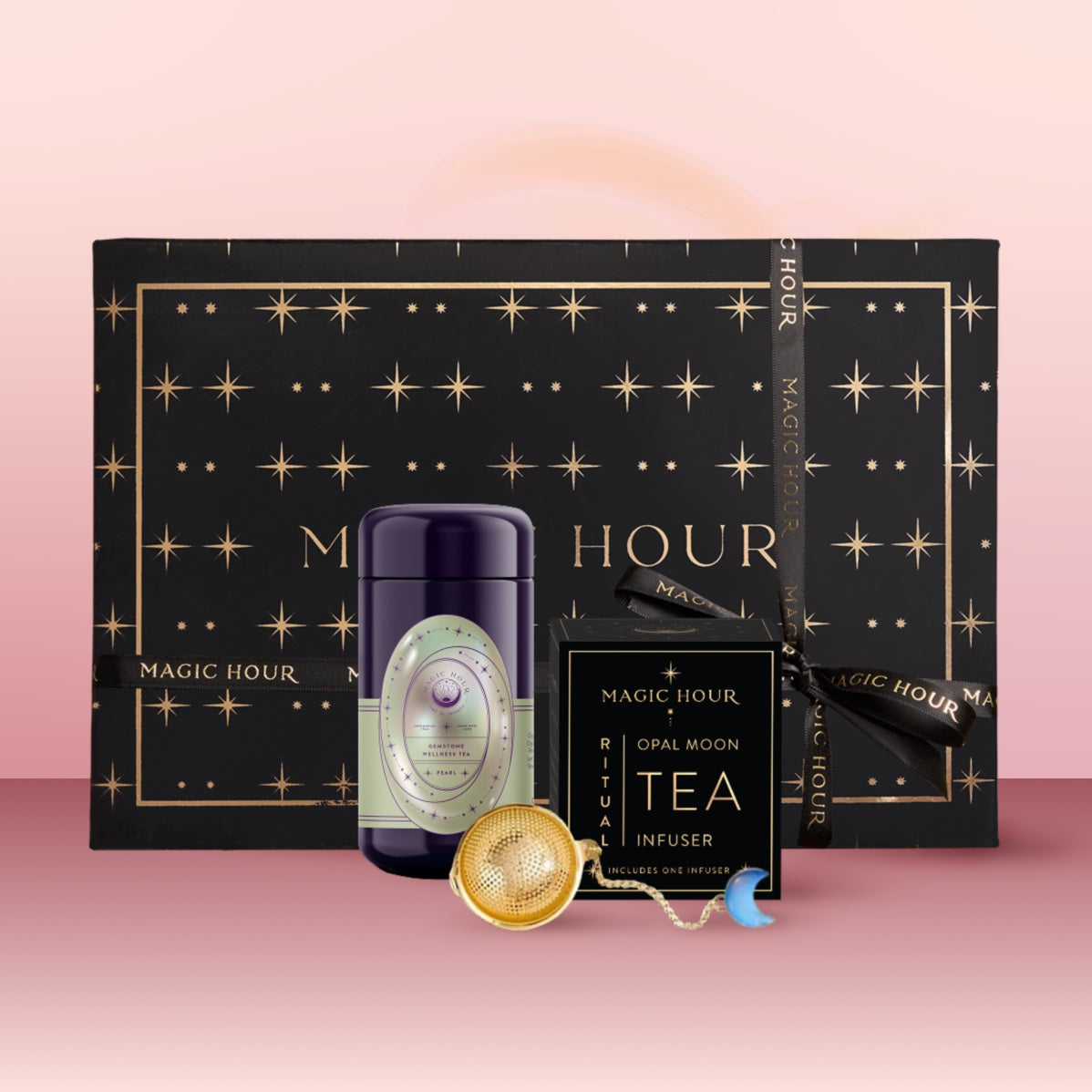 The Pearl June Birthstone Mini Gift Set includes a star-patterned black box, dark tea canister of Pearl Wellness Tea, tea infuser, and ritual card—beautifully arranged for an elegant June birthday surprise.