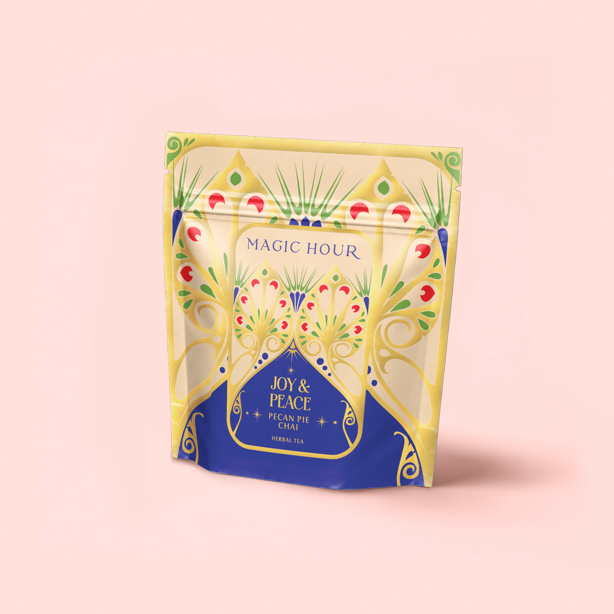A vibrant tea pouch labeled "MAGIC HOUR" features "Pecan Pie Chai" on a rich blue panel, with yellow and pink floral designs suggesting warm chai spices and calming ashwagandha inside.