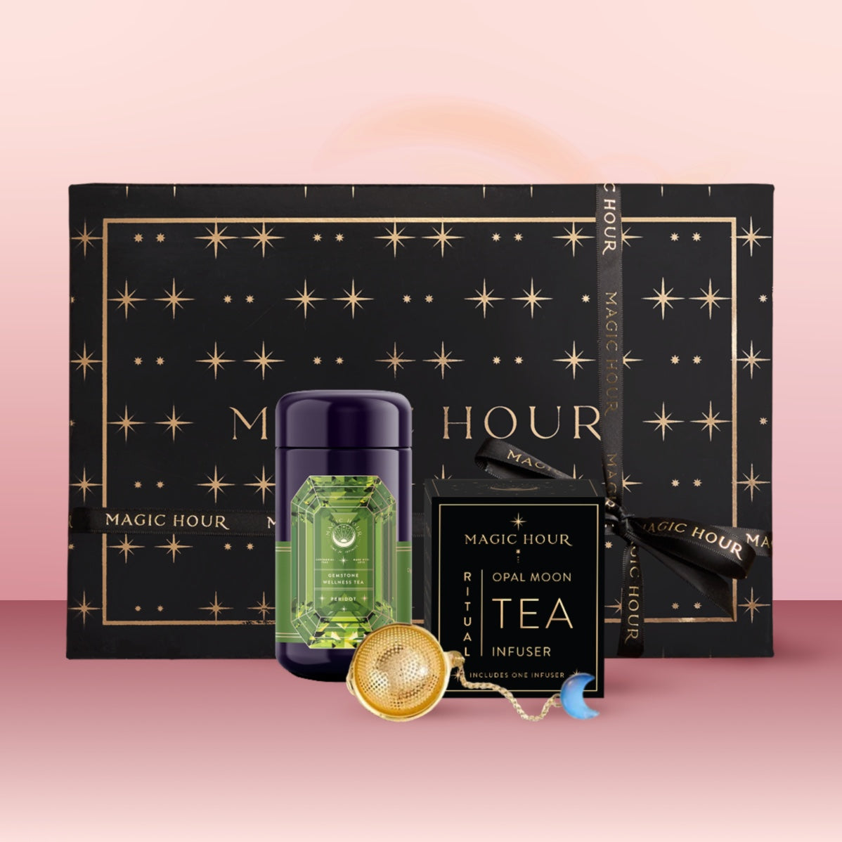 The Peridot August Birthstone Mini Gift Set features a black and gold star-patterned box, green bottle, Opal Moon Tea Infuser, and gold mesh tea infuser—perfect for gifting with Peridot Wellness Tea or your favorite botanical blend.