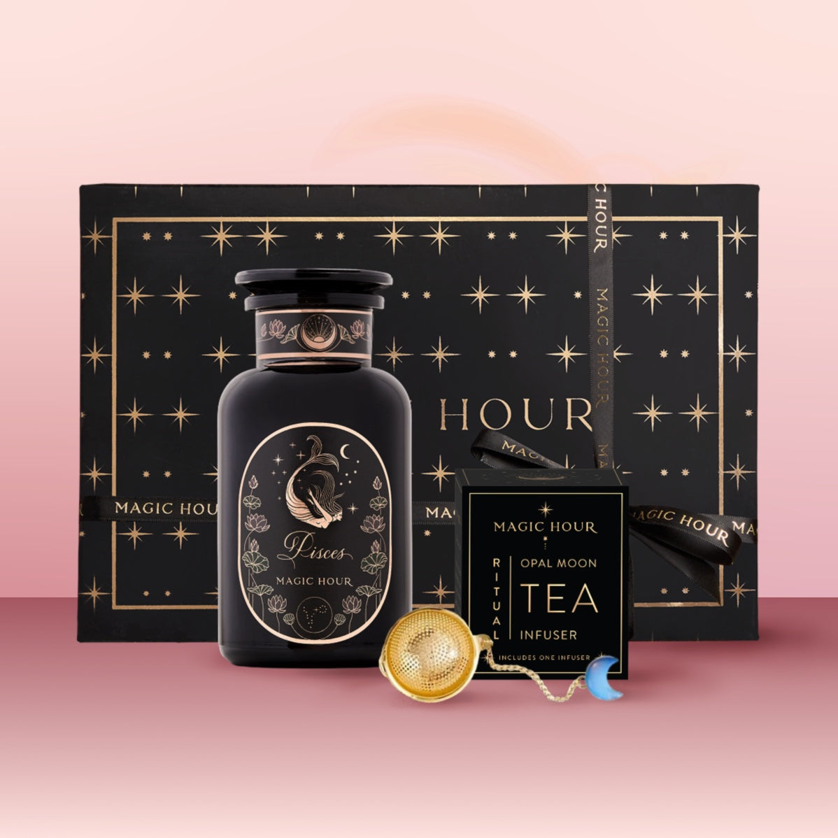 The Pisces Astrology Tea Gift Set includes a "Pisces" tea jar, a black box of opal moon ritual tea, an Opalite Moon Tea Strainer, and comes in pink gradient packaging with gold stars.