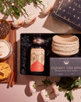 The "Pumpkin Lovers Tea & Accessory Gift Set" offers a captivating presentation with a tea jar, an elegant box of "Exquisite Star Sips" mugs, and a ceremonial tea bowl. Delight in the cozy warmth of pumpkin spice tea complemented by cinnamon sticks, dried orange slices, and floral accents.