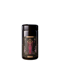 A black cylindrical container featuring intricate label art of a regal figure in a pink gown encircled by floral designs. The text reads "The Queen of Cups" and "Mugler Builder," seamlessly incorporating tarot archetypes into its design, ideal for enthusiasts of wellness teas, as part of the Monthly Magic First Sips Tea Subscription Box.