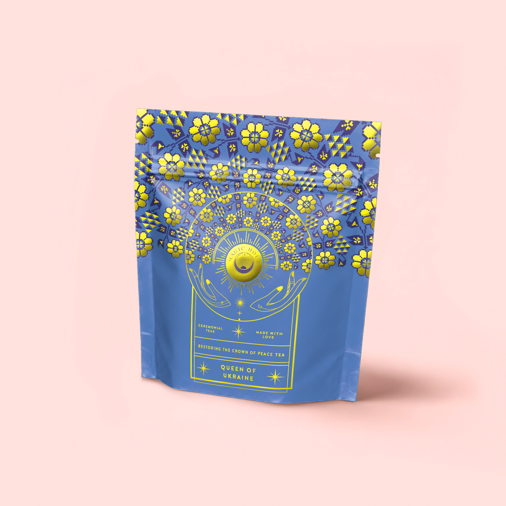 A blue and yellow resealable pouch labeled "Queen of Ukraine: Spring Blossom Tea," decorated with sunflowers and florals, is shown on a light pink background.