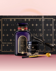 The Tea & Honey Gift Set features a dark bottle, Wildflower Honey with gold honey dipper, and a large black box with gold stars and "Magic Hour" on pink—an elegant choice for your morning ritual.