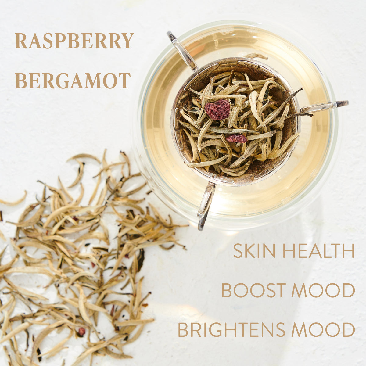 A glass cup of Raspberry Earl White Tea is shown from above, with loose leaf tea arranged around the cup. Beige text on the image reads "Raspberry Earl White Tea" and highlights benefits: "Skin Health," "Boost Mood," and "Brightens Mood." Enjoy this Club Magic Hour blend for a refreshing experience.