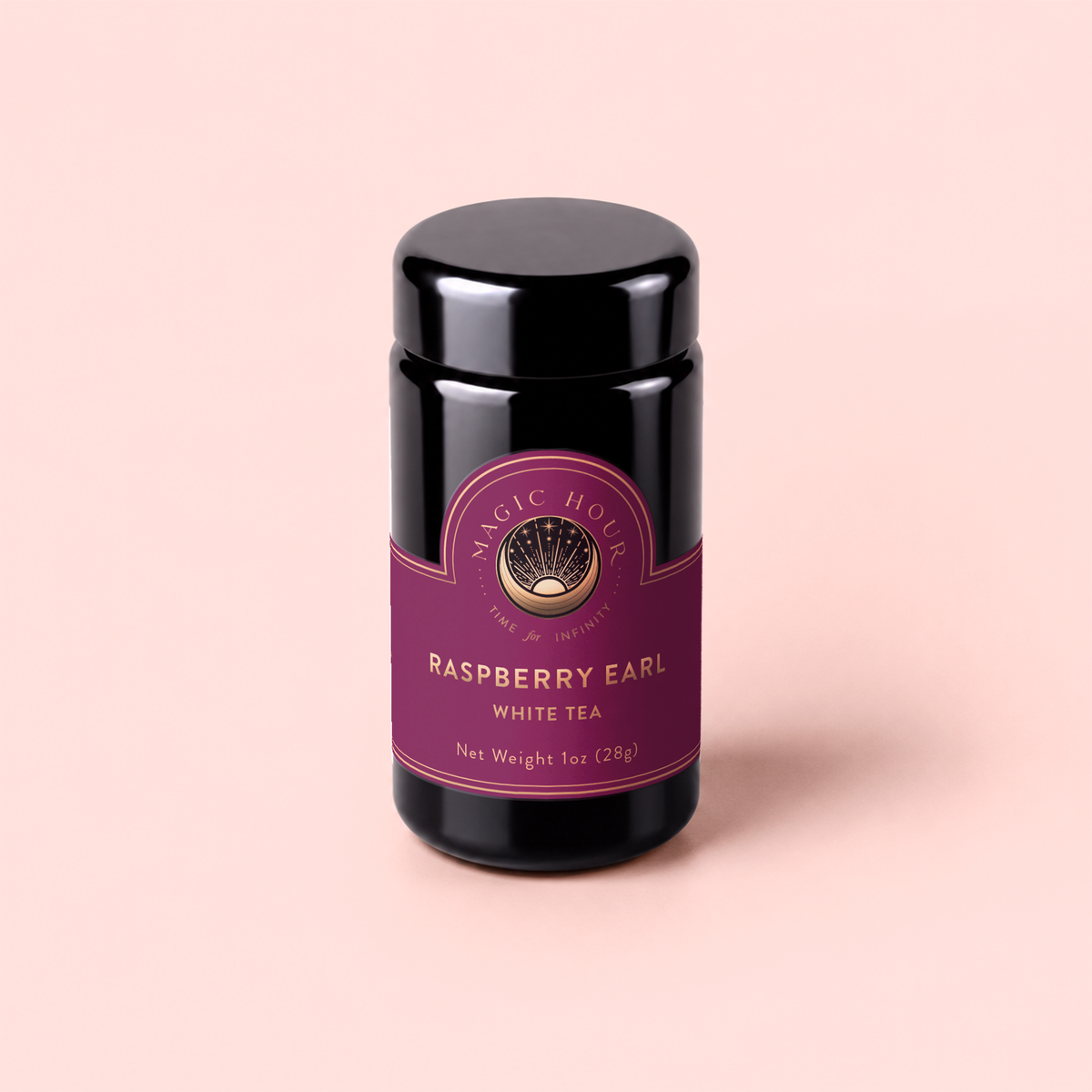 A dark jar with a purple label reading “Raspberry Earl White Tea, Net Weight 1oz (28g)”—a delightful blend infused with the subtle aroma of bergamot and packed with antioxidants—sits on a light pink background.