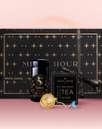 The Sagittarius Astrology Tea Gift Set features a luxurious black star-patterned box, gold-detailed black tea jar, tea infuser, and “Opal Moon” tea box, beautifully arranged on a pink surface with a matching pink background.