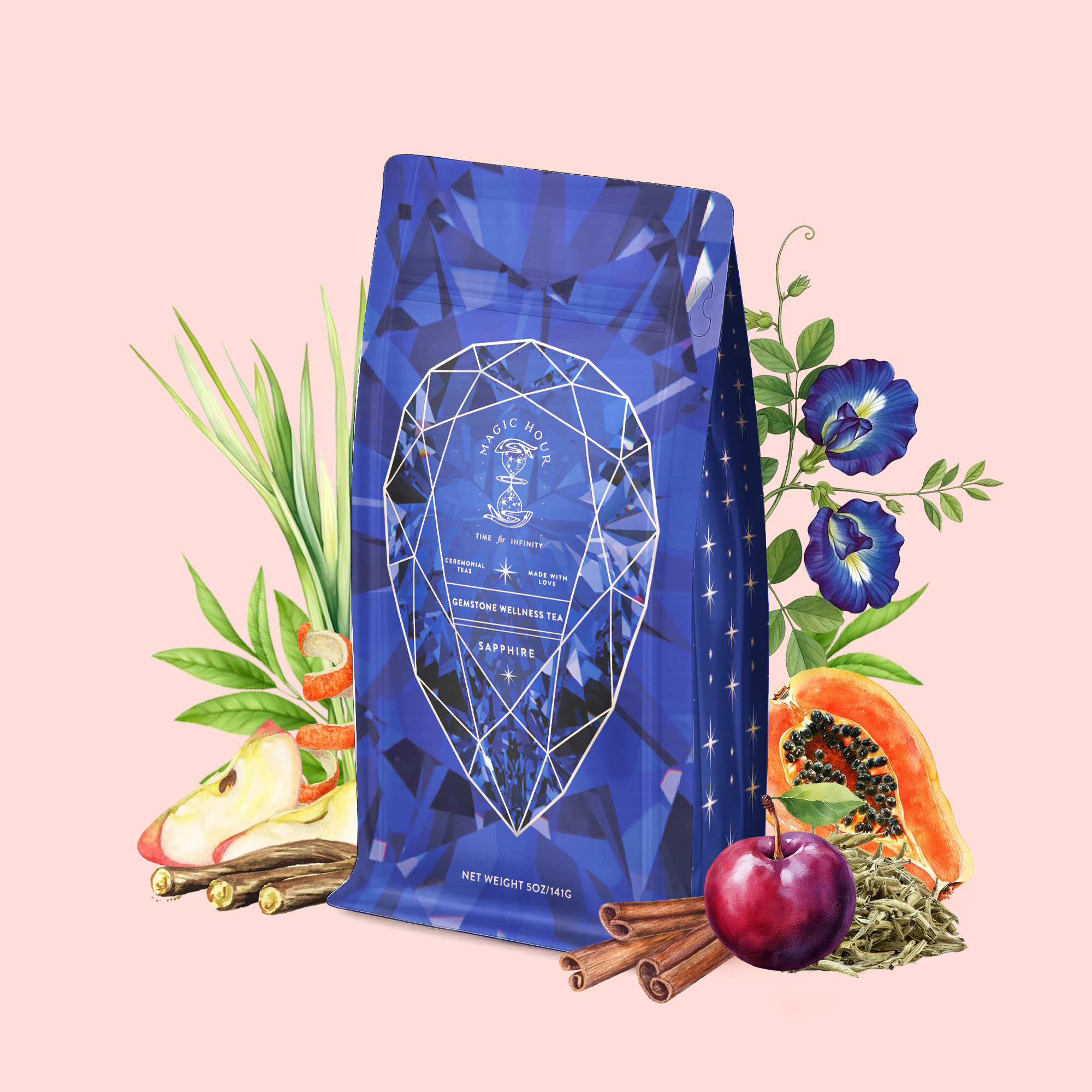 A Sapphire: Apple-Plum-Spice White Tea for Self-Expression package, featuring a gemstone-inspired design, is displayed against a pale pink background and surrounded by fresh ingredients—lemongrass, butterfly pea flowers, papaya, cherry, apple slices, cinnamon sticks, and green herbs. This grounding white tea blend invites tranquility and encourages natural wellness.