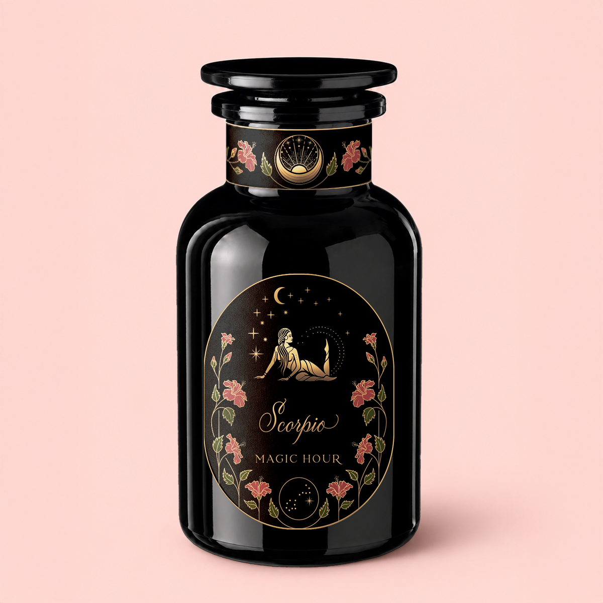A black glass bottle labeled “Scorpio Tea for Sensual Brilliance” is adorned with gold floral motifs and an illustration of a figure beneath stars and a crescent moon, set against a light pink background—an enchanting homage to the mystical allure of Scorpio tea, delicately infused with notes evocative of rose congou and saffron black tea.