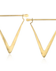 A pair of Simple Strength Earrings by Magic Hour in a geometric triangular shape. The metal is polished and features a smooth finish. The design highlights a modern silhouette, with each earring having a thin bar at the top for fastening. Made from 18k gold, these earrings are both minimalist and elegant.