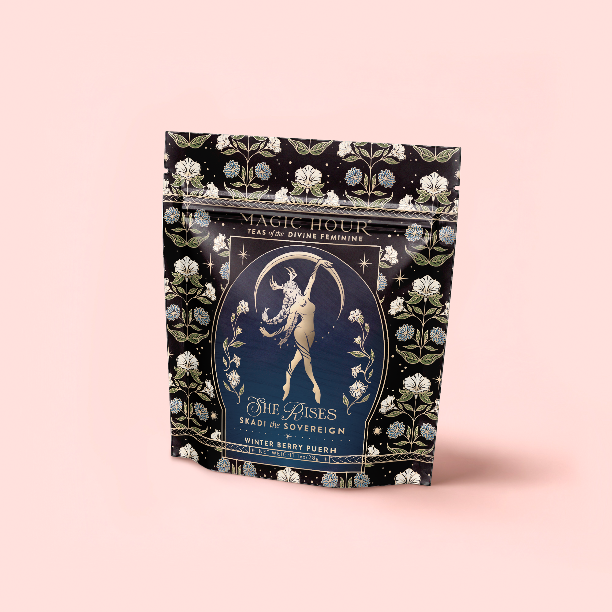 A decorative bag of Skadi The Sovereign: Winter Berry Puerh tea features floral patterns and a dancing woman beneath an arch on a black background, symbolizing winter resilience.