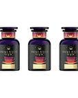 Three dark purple glass bottles of Magic Hour's "Ceremonial Soda Pop Tea Bundle" neatly arranged in a row. Each bottle showcases a label adorned with a golden crescent moon, a starry background, and an illustration of a red teacup on a saucer. These stylish bottles provide guilt-free tea blends that evoke nostalgic flavors like Cherry Cola, Lemon Lime, and Cream Soda.