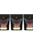 Three black pouches with gold and red accents, arranged side by side against a white background. The packaging features a gold teacup with the text "Small Batch Magic" prominently displayed above it, showcasing the wonderfully nostalgic flavors of the guilt-free Ceremonial Soda Pop Tea Bundle from Magic Hour, featuring Cherry Cola, Lemon Lime, and Cream Soda teas.