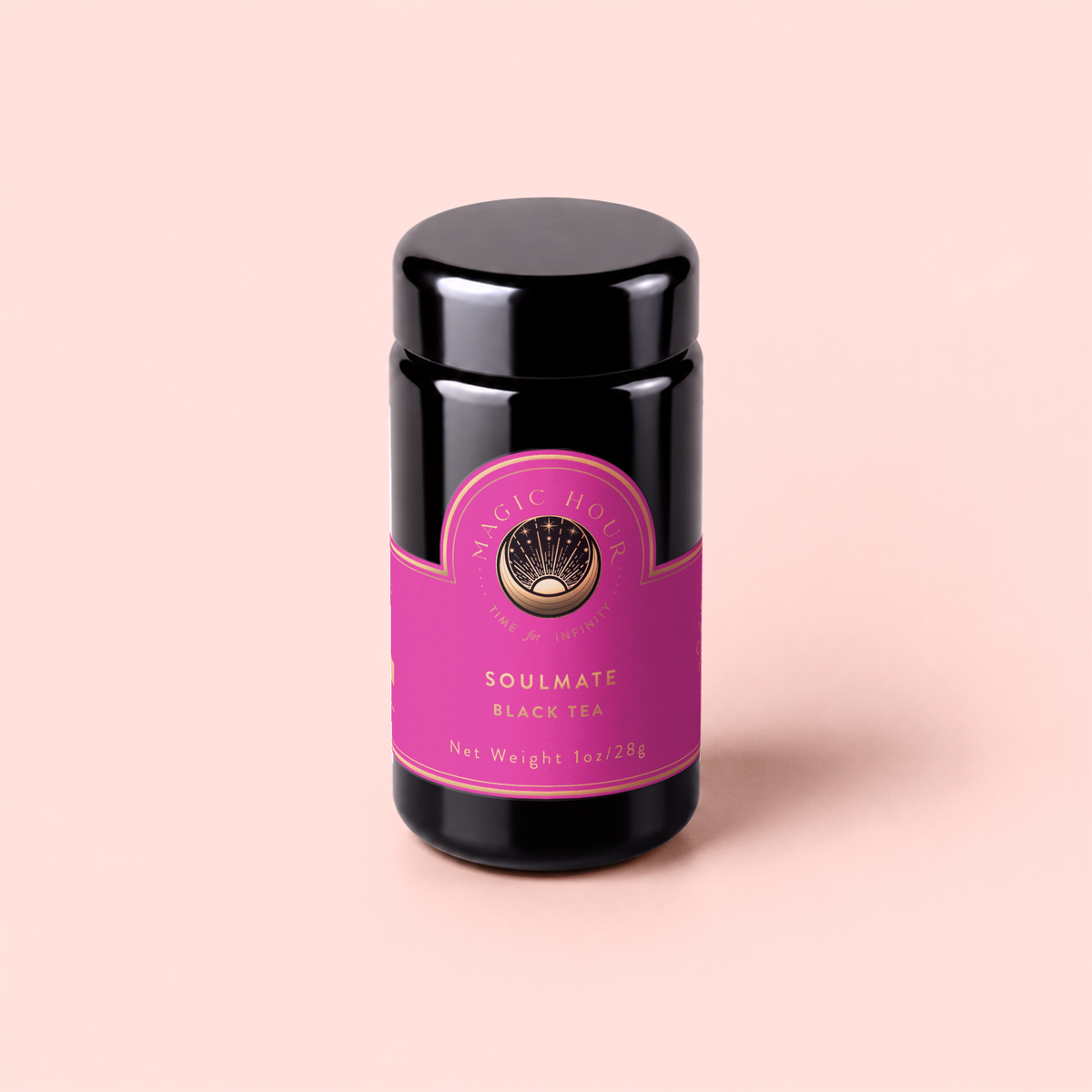 A black jar labeled “Soulmate: Chocolate-Raspberry-Rose Black Tea for Finding &amp; Celebrating Love,” adorned with a pink and gold design, sits on a light pink background—a wellness-boosting tea inspired by rich notes of chocolate, raspberry, and rose.