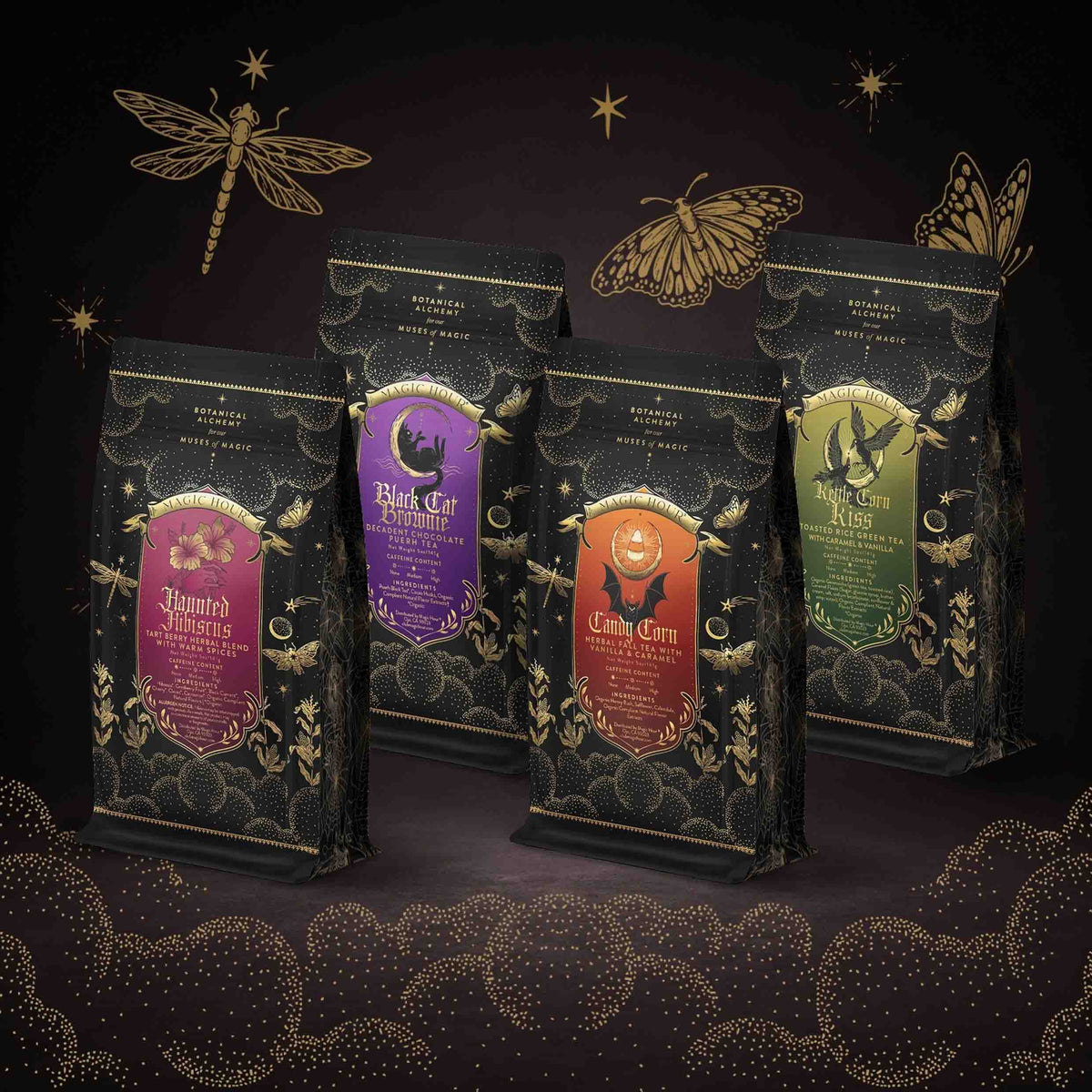 Four black, purple, orange, and green Spellbound Sips Bundle stand-up tea pouches, each with a gold label featuring thematic illustrations like a bat, a cat on a crescent moon, and a witch’s hat.