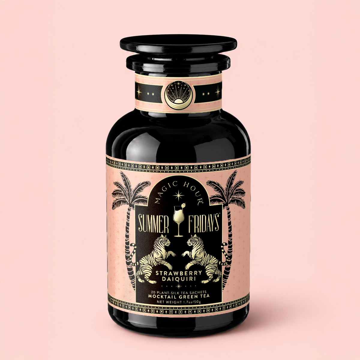 A black and pink bottle labeled “Strawberry Daiquiri: Green Berry Mocktail Tea for Beautiful, Hydrated Skin from Within,” featuring palm trees and a tropical design, is set against a light pink background—evoking the refreshing vibe of a green berry mocktail tea that’s perfect for those who love summer tea moments.