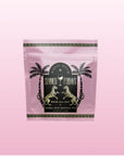 A pink resealable pouch labeled "Summer Fridays™: Rose All Day" features palm trees, leopards, and a cocktail glass. This alcohol-free herbal rose mocktail tea blends tropical fruits on a gradient pink background.