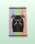 A pastel package of Summer Fridays™: Mojito Mint features palm trees, zebras, a rainbow gradient background, and highlights refreshing zero-proof details and ingredients on the front.