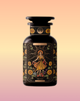 A dark amber bottle from Magic Hour, adorned with ornate label designs, features an illustration of a woman in a yellow dress surrounded by sunflowers and foliage. Titled "The Sun: Energizing Adaptogenic Herbal Tea with Yaupon, Moringa & Turmeric," the bottle has a black cap and displays intricate floral patterns with a mystical theme.