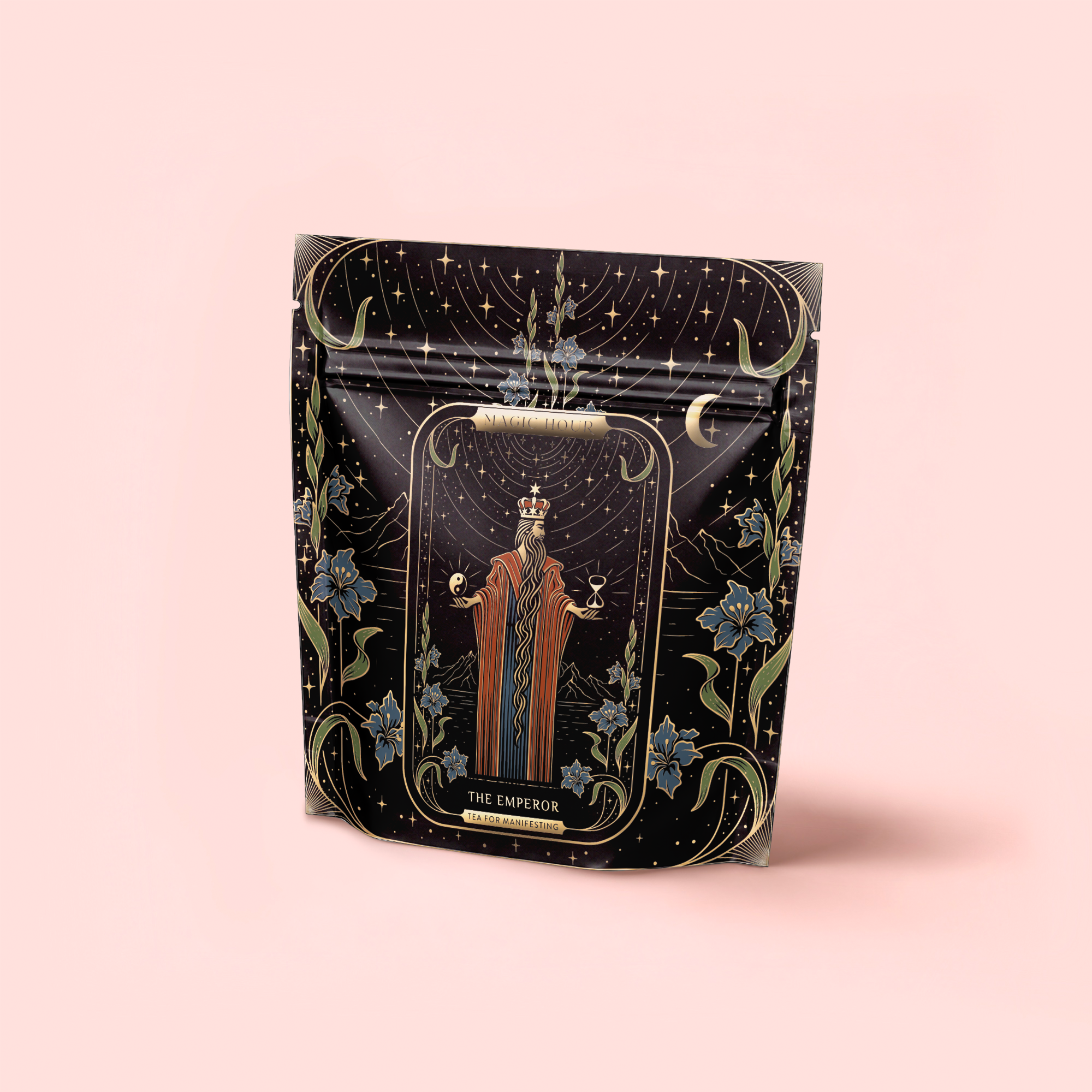 A decorative black pouch featuring "The Emperor: Green Chaga Chai with Lion's Mane and Reishi" artwork—regal figure, floral motifs, and moons—perfect for storing your favorite immune-support mushroom or gunpowder green tea.