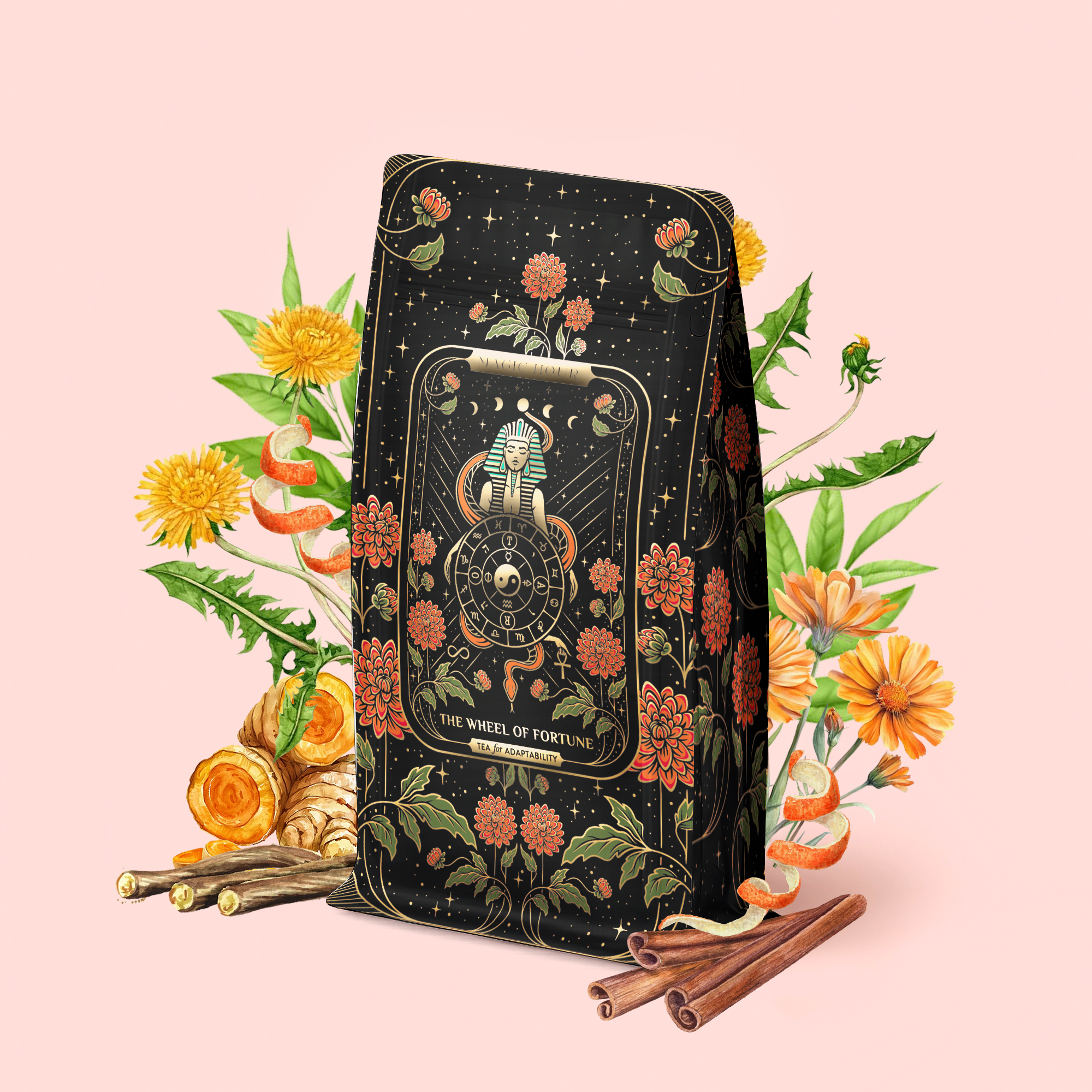 A tarot-inspired package of "The Wheel of Fortune: Ginseng Spice Tea for Adapting to Change" sits amid orange flowers, dandelions, cinnamon sticks, and roots on a soft pink background—this detox adaptogenic blend brings a unique twist to tradition.