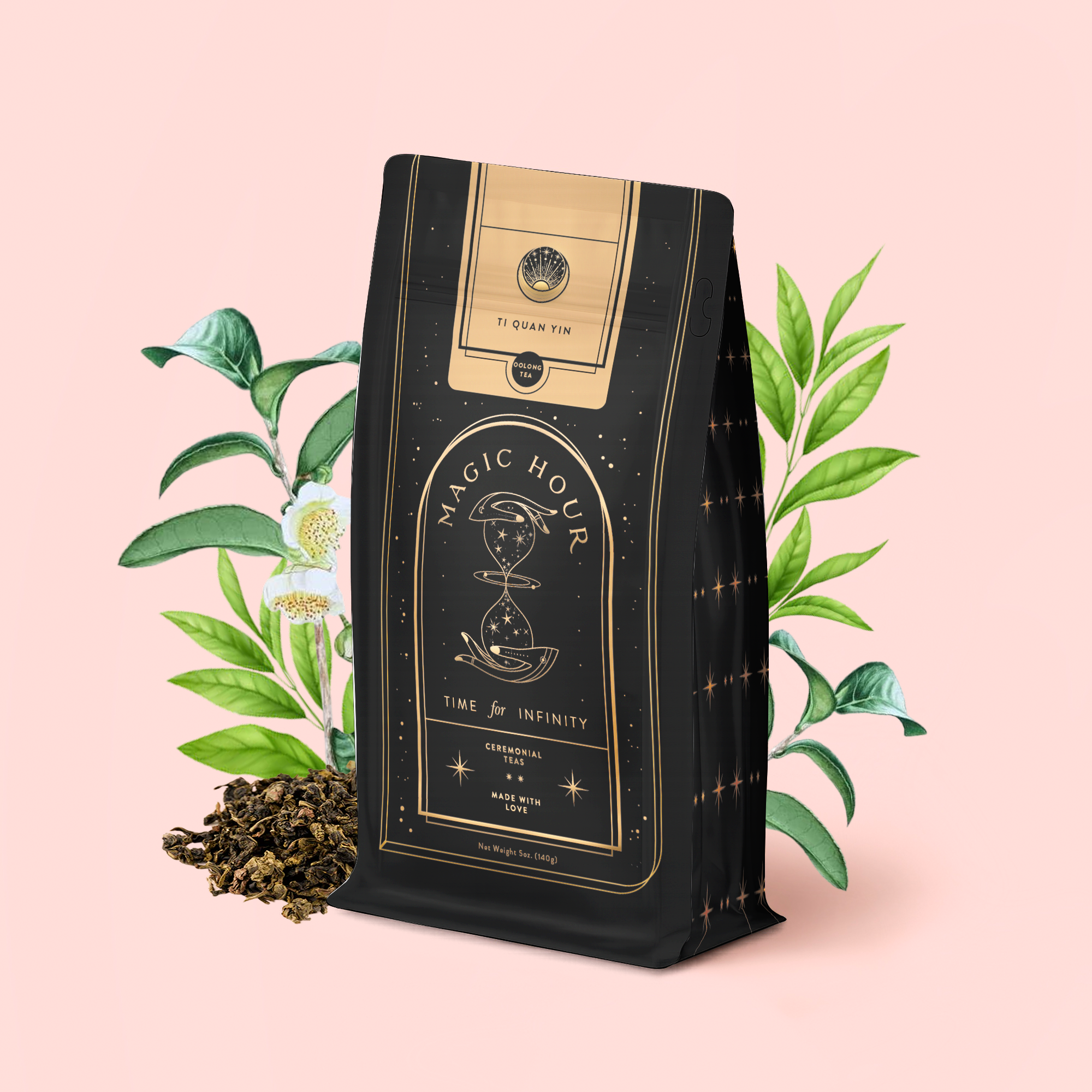 A black bag of "Ti Quan Yin Oolong: Tea of Patient Compassion" rests before green leaves and white tea flowers, with loose oolong scattered on a pink background. The package shows a gold hourglass and celestial symbols, celebrating wellness benefits.