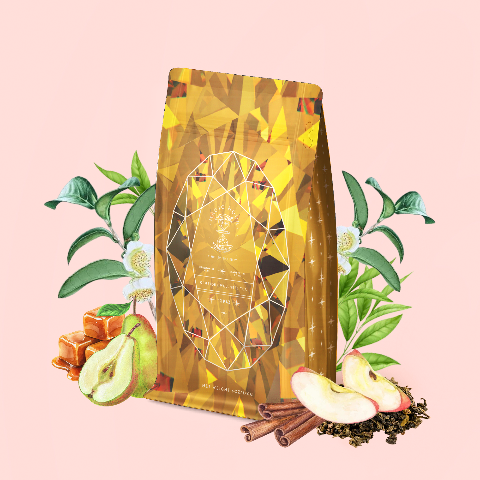 A golden coffee bag adorned with a geometric pattern is surrounded by caramel, pear, apple slices, cinnamon sticks, tea leaves, and green foliage on a light pink background—an inviting scene that beautifully highlights the uplifting and metabolism-boosting benefits of Topaz - Caramel Apple Oolong Tea for Optimism &amp; a Lightness of Being.