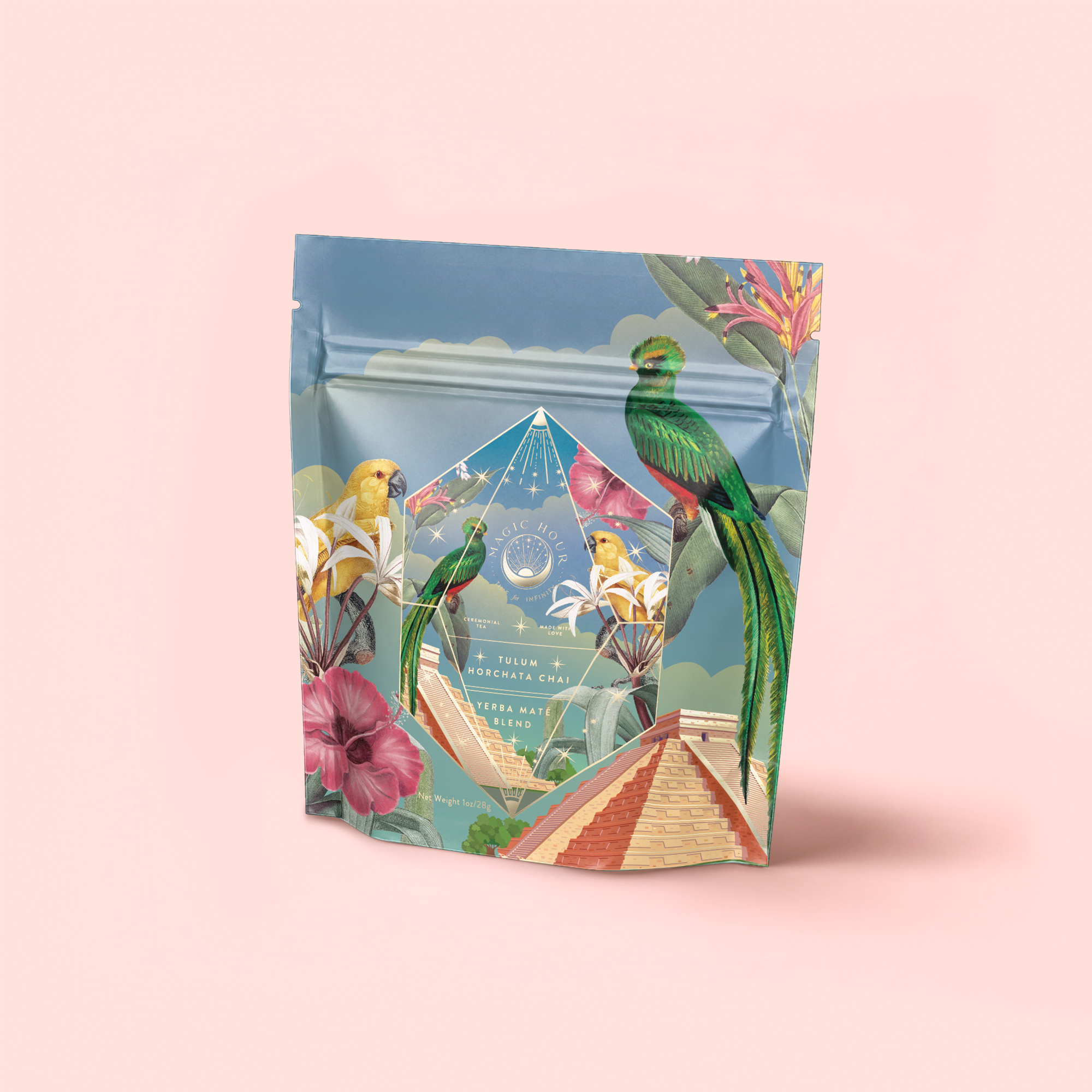 A vibrant package with tropical birds, flowers, and a pyramid on a soft pink background houses Tulum Horchata Chai, an adaptogenic drink featuring gold and blue design accents for a distinctive, eye-catching look.