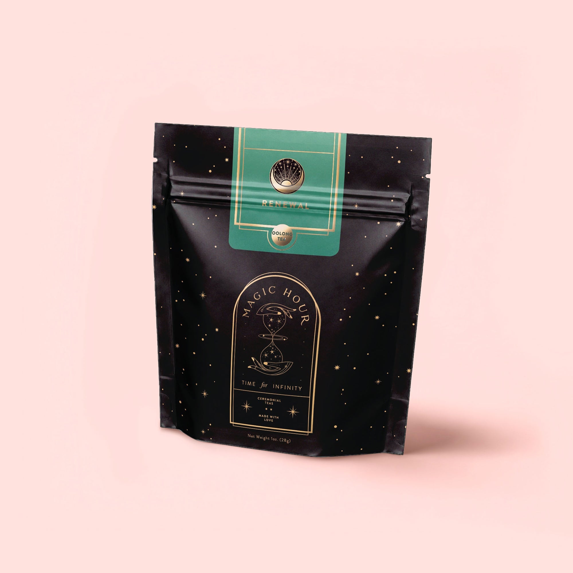 A black resealable pouch labeled "Renewal: Peach-Goji-Rose Oolong Tea" with gold stars and a celestial design stands upright on a pink background. The label features a green top section with a circular emblem, hinting at sweet Peach notes.