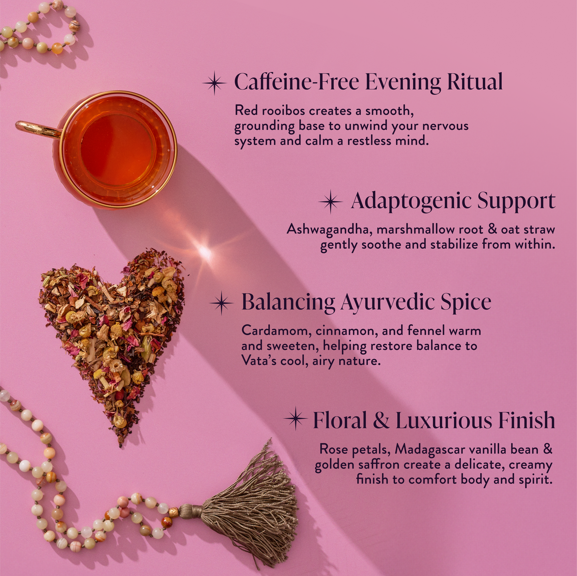 A cup of Vata: Caffeine-Free Saffron-Rose Spice Tea sits on a pink background beside a heart-shaped pile of tea herbs and a golden tassel, showcasing its relaxing Ayurvedic adaptogen blend and floral notes.