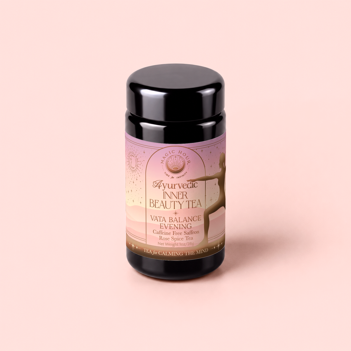 A jar of Vata: Caffeine-Free Saffron-Rose Spice Tea for Inner Beauty Evening sits on a pink background. The label highlights this caffeine-free herbal blend, featuring saffron, rose, and spices, along with the silhouette of a dancing figure. This soothing ashwagandha-infused tea is crafted to promote balance and relaxation.